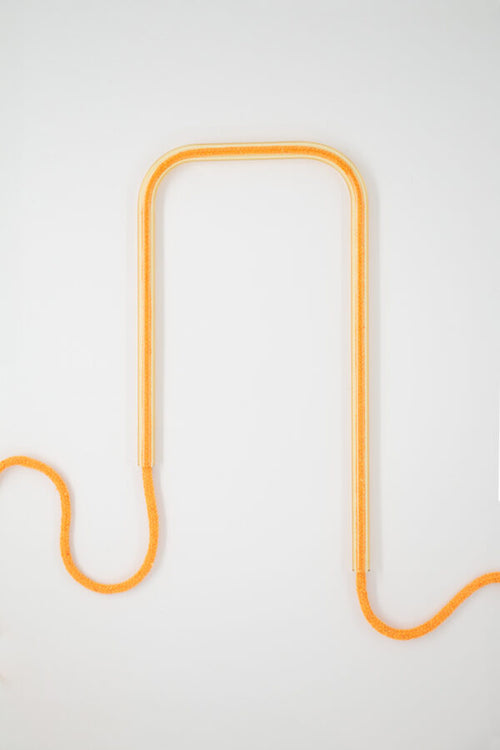 Front view of Citrus Glow glass self-watering insert on a clean white background showing its bright, vibrant yellow and citrus tones.