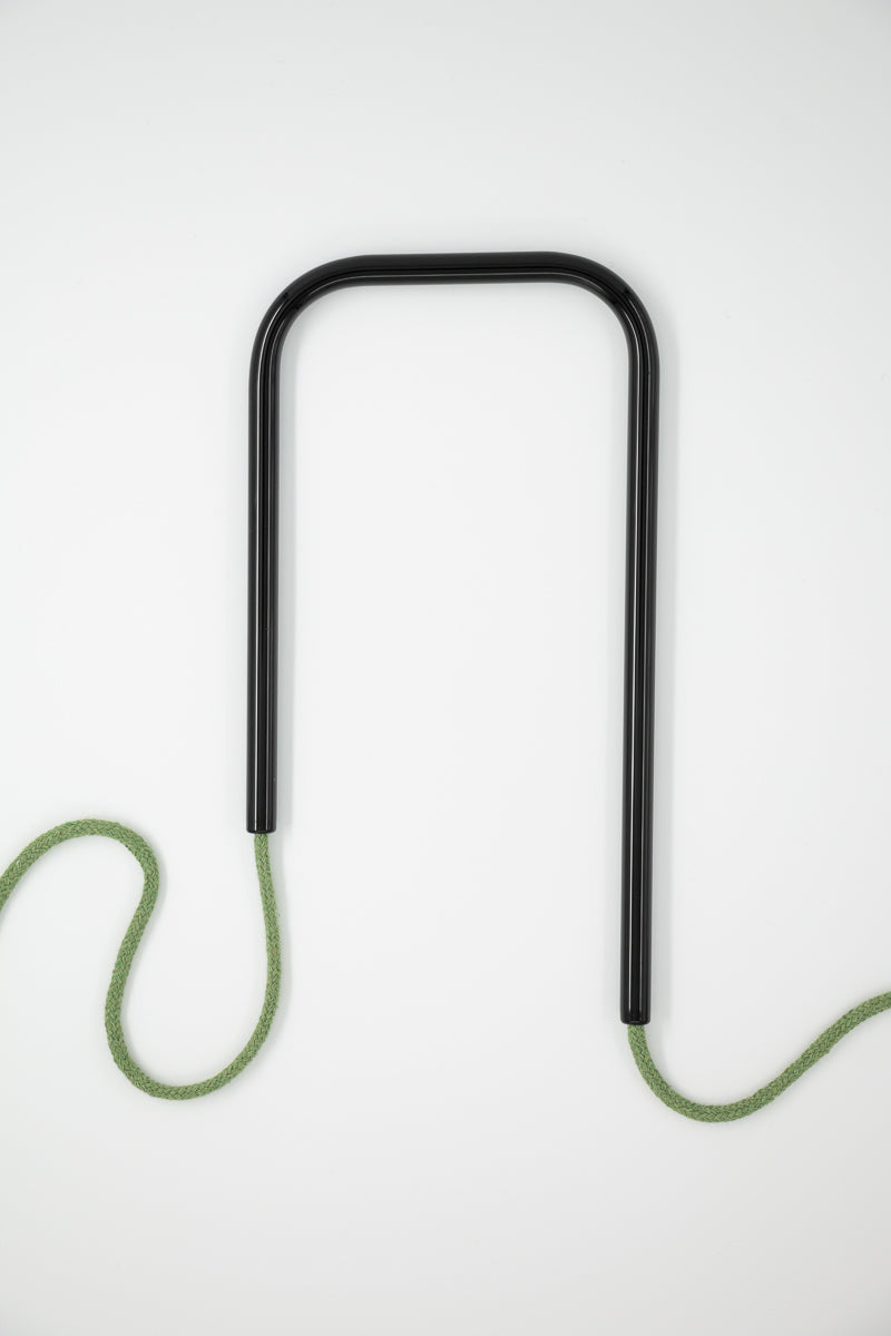 Front view of Dark Forest glass self-watering insert on a clean white background showing its moody deep black and rich green colorway.
