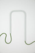 Front view of Frosted Thyme glass self-watering insert on a clean white background showing its soft sage green and frosted white finish.