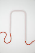 Front view of Frozen Clay glass self-watering insert on a clean white background showing its crisp frosted white and warm terracotta base colors.