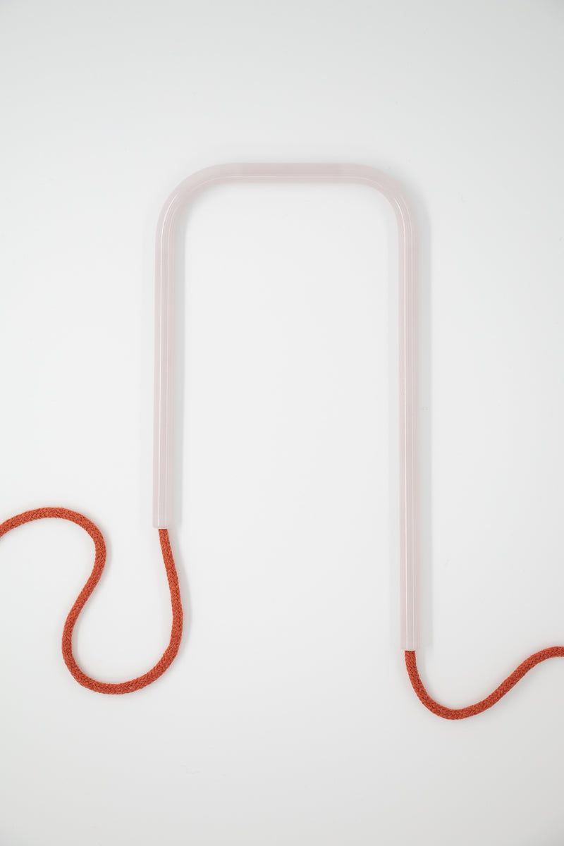 Front view of Frozen Clay glass self-watering insert on a clean white background showing its crisp frosted white and warm terracotta base colors.