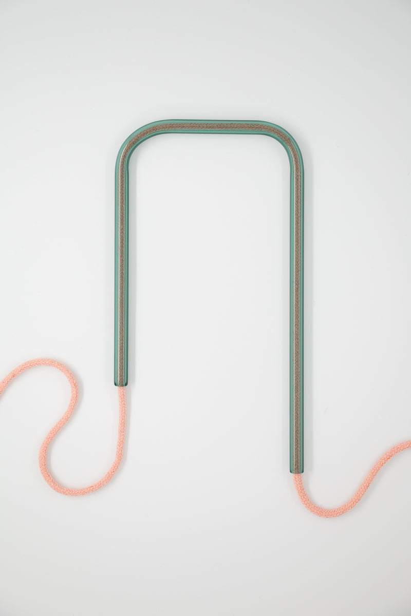 Front view of Lake Bloom glass self-watering insert on a clean white background showing its serene soft green and gentle pink colorway.