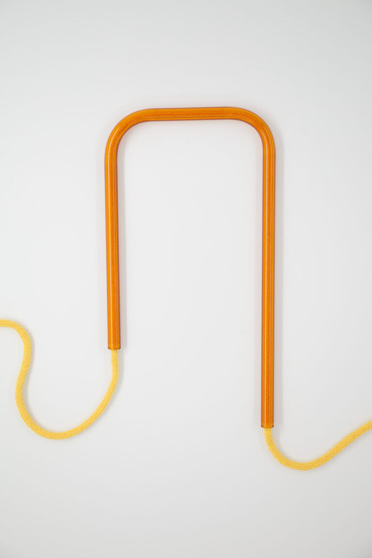 Front view of Molten Honey glass self-watering insert on a clean white background showing its rich golden amber colorway.