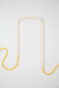 Front view of Snowy Sunflower glass self-watering insert on a clean white background showing its crisp white and sunflower yellow color palette.