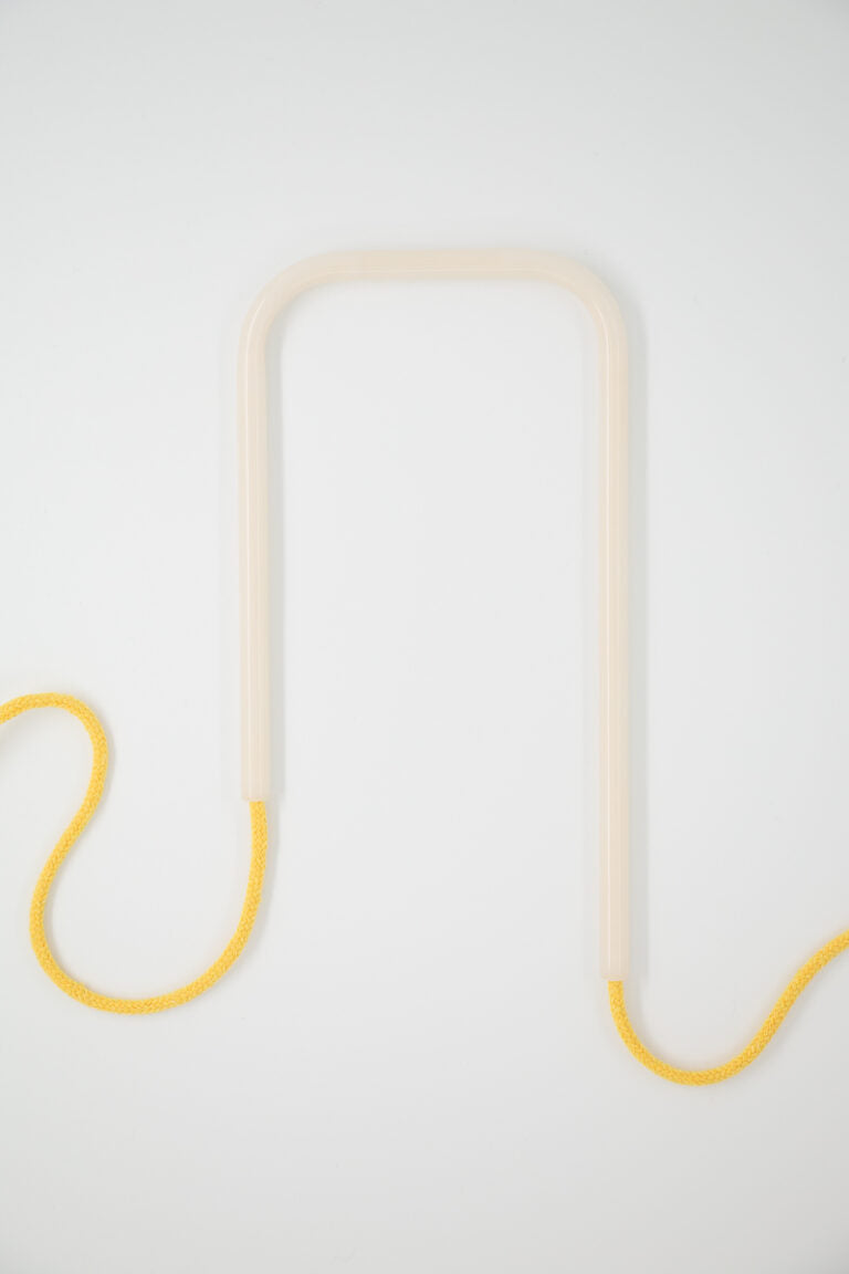 Front view of Snowy Sunflower glass self-watering insert on a clean white background showing its crisp white and sunflower yellow color palette.